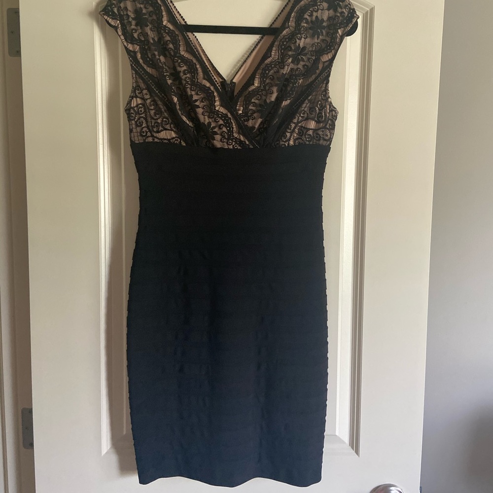 Adrianna Papell black tired dress. Lace surplice top with nude lining.